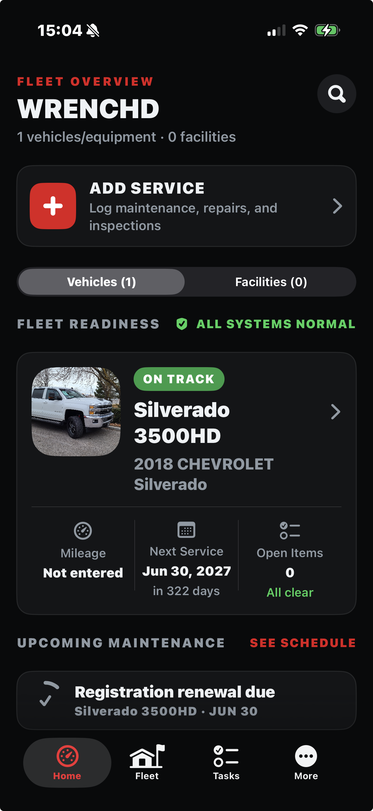 Wrenchd fleet overview showing a vehicle on track with mileage, next service, and open items